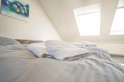 Ein Bett oder Betten in einem Zimmer der Unterkunft Ferienhaus Eulenspiegel