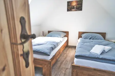 Ein Bett oder Betten in einem Zimmer der Unterkunft Ferienhaus Eulenspiegel