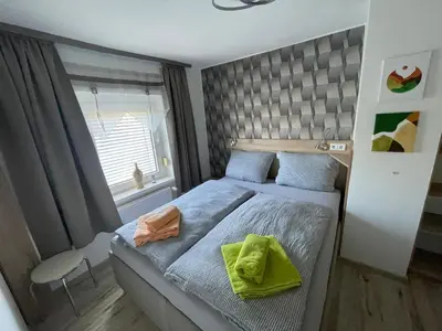 Ein Bett oder Betten in einem Zimmer der Unterkunft Ferienwohnung Holzwurm