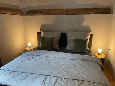 Ein Bett oder Betten in einem Zimmer der Unterkunft Bergrauschen - Waldbude