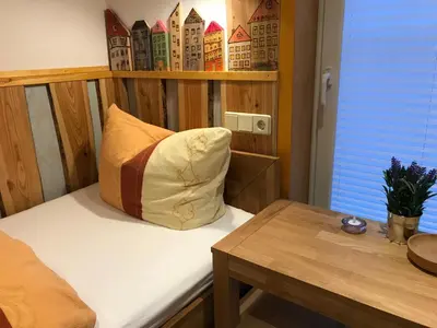 Ein Bett oder Betten in einem Zimmer der Unterkunft Ferienwohnung - Haus Molle