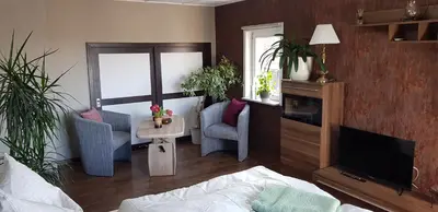 Ein Sitzbereich in der Unterkunft Ferienwohnung Malu Sol im Harz - stilvoll, gemütlich, tierfreundlich - mit Garten