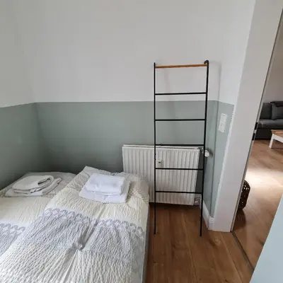Ein Bett oder Betten in einem Zimmer der Unterkunft Villa am Paulsberg