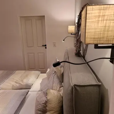 Ein Bett oder Betten in einem Zimmer der Unterkunft Villa am Paulsberg