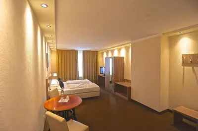 Ein Bett oder Betten in einem Zimmer der Unterkunft Carea Harz Hotel Allrode