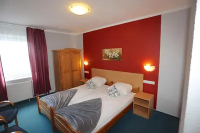 Ein Bett oder Betten in einem Zimmer der Unterkunft Carea Harz Hotel Allrode