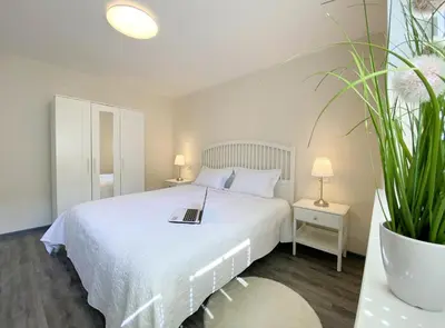 Ein Bett oder Betten in einem Zimmer der Unterkunft REGIOHOTEL Aparthotel Wernigerode - #Ferienwohnungen #Familienfreundlich #Harzurlaub #Freeparking