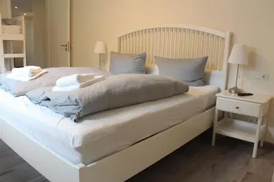 Ein Bett oder Betten in einem Zimmer der Unterkunft REGIOHOTEL Aparthotel Wernigerode - #Ferienwohnungen #Familienfreundlich #Harzurlaub #Freeparking