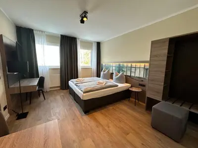 Ein Bett oder Betten in einem Zimmer der Unterkunft Lieblingsquartier Sankt Andreasberg Studio 9