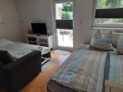 Ein Bett oder Betten in einem Zimmer der Unterkunft Kleine gemütliche Ferienwohnung günstige Lage