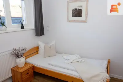 Ein Bett oder Betten in einem Zimmer der Unterkunft Pension Zum Hexenstieg