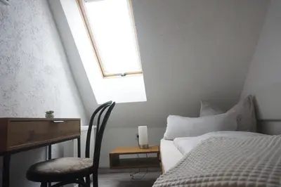 Ein Bett oder Betten in einem Zimmer der Unterkunft Pension Zum Lukullus