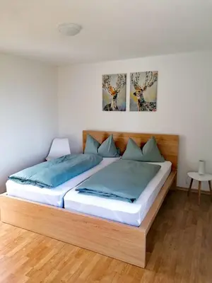 Ein Bett oder Betten in einem Zimmer der Unterkunft Ferienhaus Chiara, Südharz, Harztor