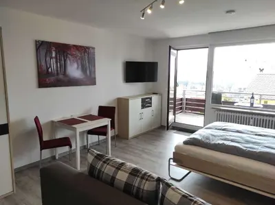 Ein Bett oder Betten in einem Zimmer der Unterkunft Ferienwohnung Hangblick