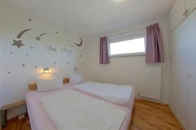 Ein Bett oder Betten in einem Zimmer der Unterkunft Apartment 240