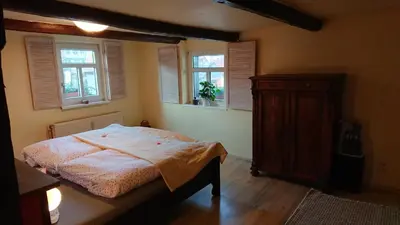 Ein Bett oder Betten in einem Zimmer der Unterkunft Ferienwohnung Zur Ellernmühle