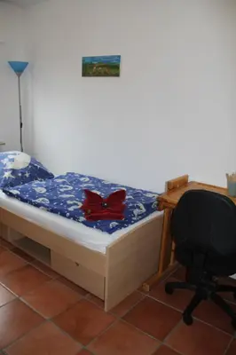 Ein Bett oder Betten in einem Zimmer der Unterkunft Ferienwohnung Waldwichtel