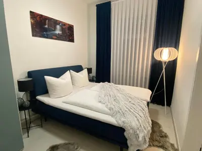 Ein Bett oder Betten in einem Zimmer der Unterkunft Ferienwohnung Univers 3