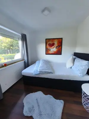 Ein Bett oder Betten in einem Zimmer der Unterkunft FeWo Goslar Harz