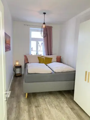 Ein Bett oder Betten in einem Zimmer der Unterkunft Ferienwohnungen Albarts by Mountain apart