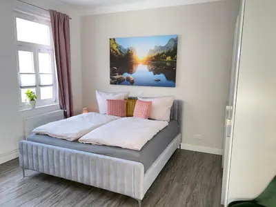 Ein Bett oder Betten in einem Zimmer der Unterkunft Ferienwohnungen Albarts by Mountain apart