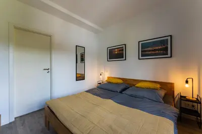 Ein Bett oder Betten in einem Zimmer der Unterkunft Ferienwohnung am Steinbach 1