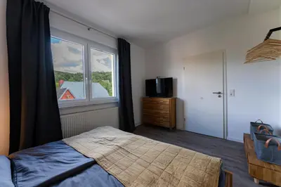 Ein Bett oder Betten in einem Zimmer der Unterkunft Ferienwohnung am Steinbach 1