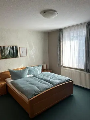 Ein Bett oder Betten in einem Zimmer der Unterkunft Pension 