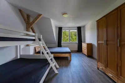 Ein Bett oder Betten in einem Zimmer der Unterkunft Ferienwohnung am Steinbach 2