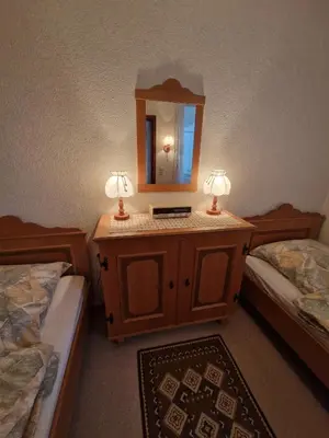 Ein Bett oder Betten in einem Zimmer der Unterkunft Urige Ferienwohnung Bocksbergblick Ferienpark Hahnenklee
