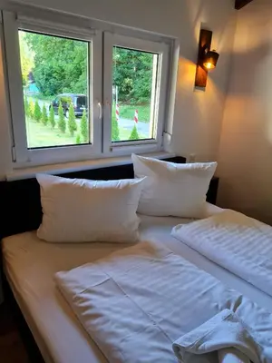Ein Bett oder Betten in einem Zimmer der Unterkunft Haus DeMa