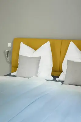 Ein Bett oder Betten in einem Zimmer der Unterkunft Saphir Quartier