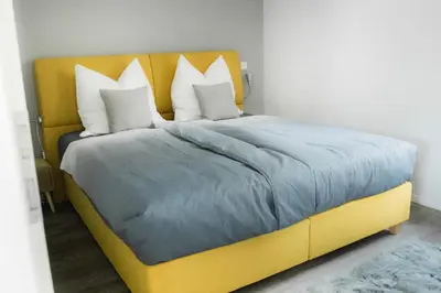 Ein Bett oder Betten in einem Zimmer der Unterkunft Saphir Quartier