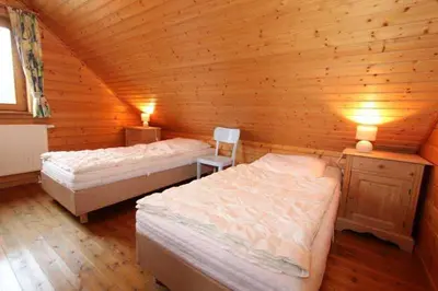 Ein Bett oder Betten in einem Zimmer der Unterkunft Naturerlebnisdorf Blauvogel im Harz