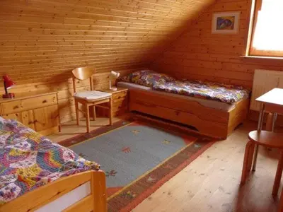 Ein Bett oder Betten in einem Zimmer der Unterkunft Naturerlebnisdorf Blauvogel Hasselfelde