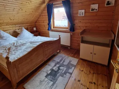 Ein Bett oder Betten in einem Zimmer der Unterkunft Ferienhaus im Naturerlebnisdorf Blauvogel
