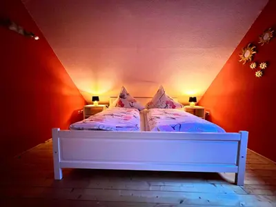 Ein Bett oder Betten in einem Zimmer der Unterkunft Haus Krönchen