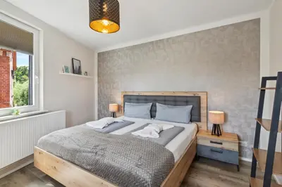 Ein Bett oder Betten in einem Zimmer der Unterkunft Harztanne - Rückzugsort mit Grill & Parkplatz