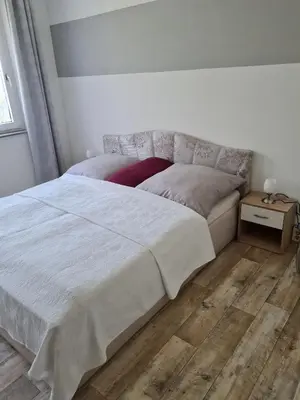 Ein Bett oder Betten in einem Zimmer der Unterkunft Ferienwohnung Sattlerbad