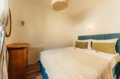 Ein Bett oder Betten in einem Zimmer der Unterkunft Harzglanz FeWo's HARZbock