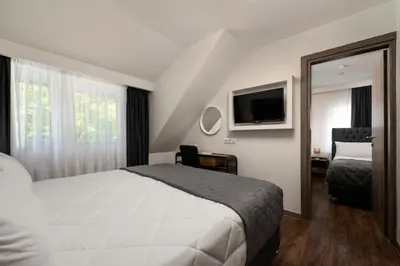 Ein Bett oder Betten in einem Zimmer der Unterkunft Angelo Spa Resort
