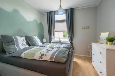 Ein Bett oder Betten in einem Zimmer der Unterkunft Ferienwohnung LichtBlickHarz