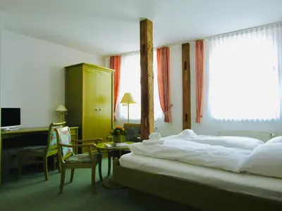Ein Bett oder Betten in einem Zimmer der Unterkunft Pension Hexenkessel