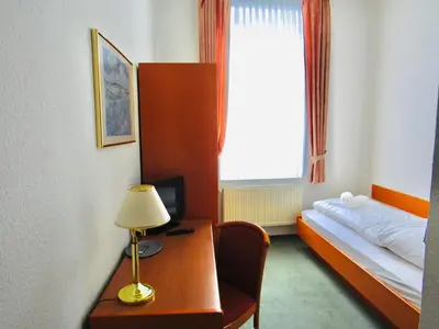 Ein Bett oder Betten in einem Zimmer der Unterkunft Pension Hexenkessel