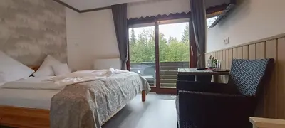 Ein Bett oder Betten in einem Zimmer der Unterkunft Quellenhof Altenau