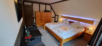 Ein Bett oder Betten in einem Zimmer der Unterkunft Quellenhof Altenau