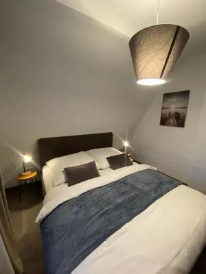 Ein Bett oder Betten in einem Zimmer der Unterkunft Ferienhaus International