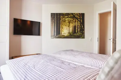 Ein Bett oder Betten in einem Zimmer der Unterkunft Mountain Suites Braunlage - Bergzauber