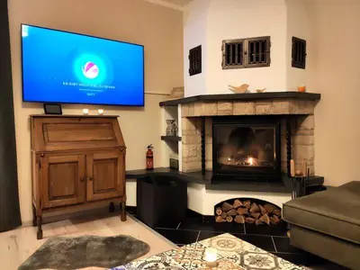 TV/Unterhaltungsangebot in der Unterkunft Ferienhaus Blaue Blume mit 11 kW Ladestation, Kamin, Terrasse, eingezäuntem Garten, Sauna, WLAN, Netflix, 2 Hunde willkommen!