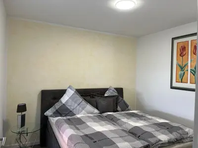 Ein Bett oder Betten in einem Zimmer der Unterkunft Ellas Ferienhaus